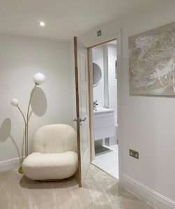 neutral colours, modern living area, fluffy chair, period skirting